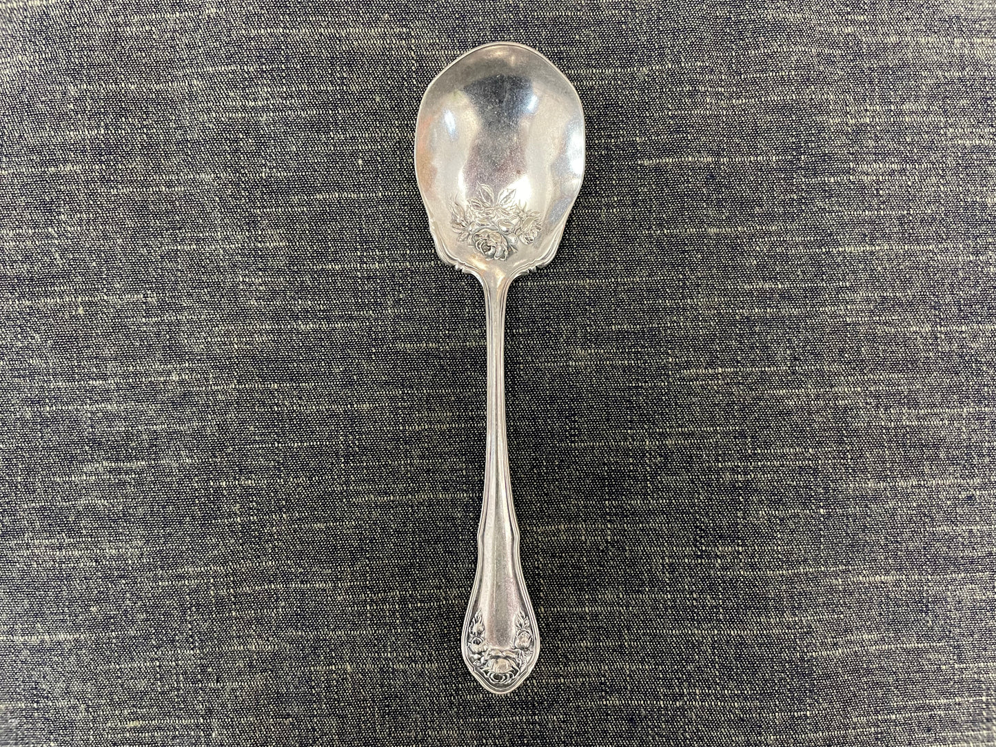 antique silver small serving spoon for serving or prop photography