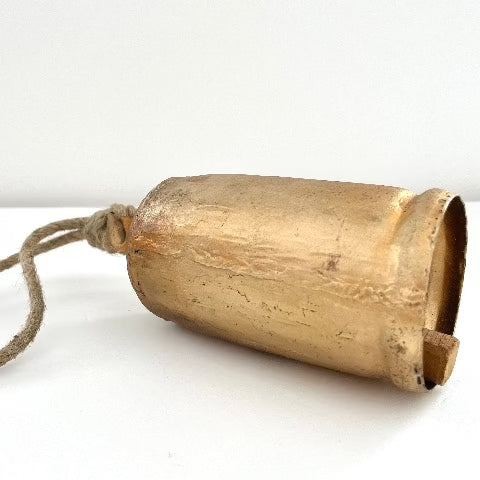 6 1/2" rustic tin bell with brass finish and wood striker