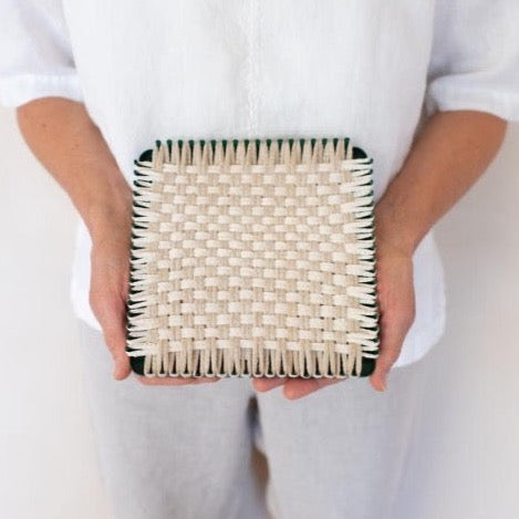 handmade 100 percent cotton bobble woven potholder or trivet on the loom for a farmhouse kitchen
