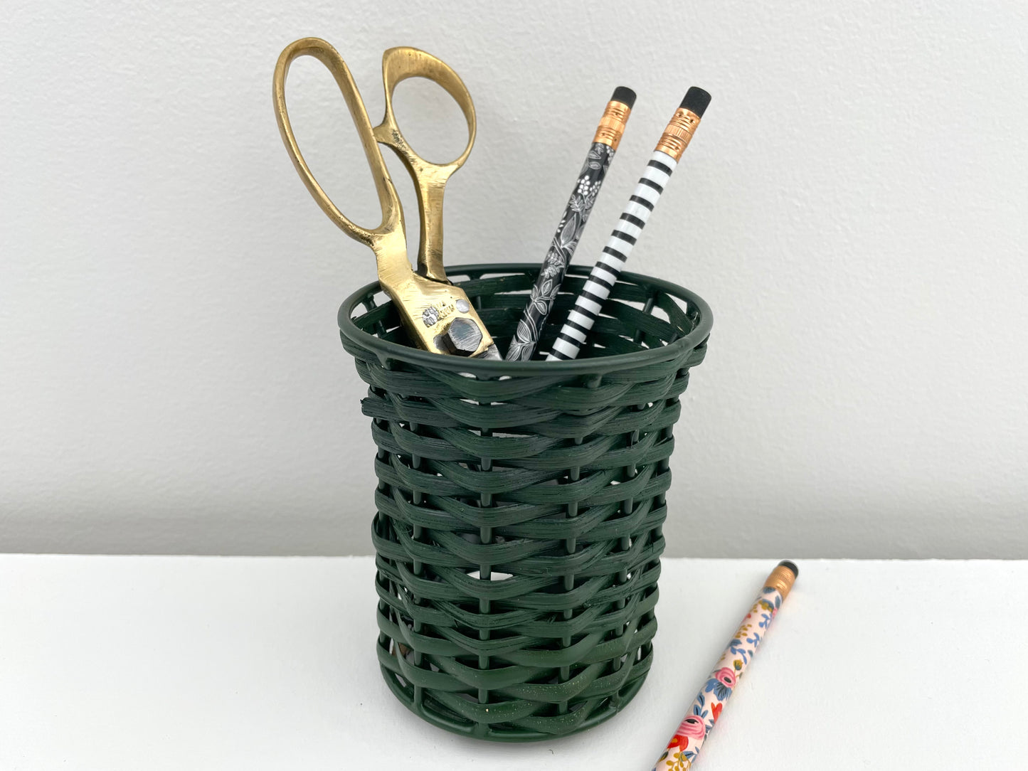 hunter green cane and iron woven pencil and pen holder