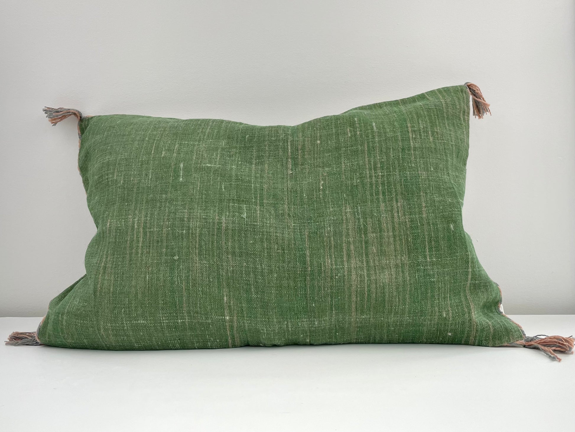 green linen 24x16 lumbar pillow cover with striped edging and tassels