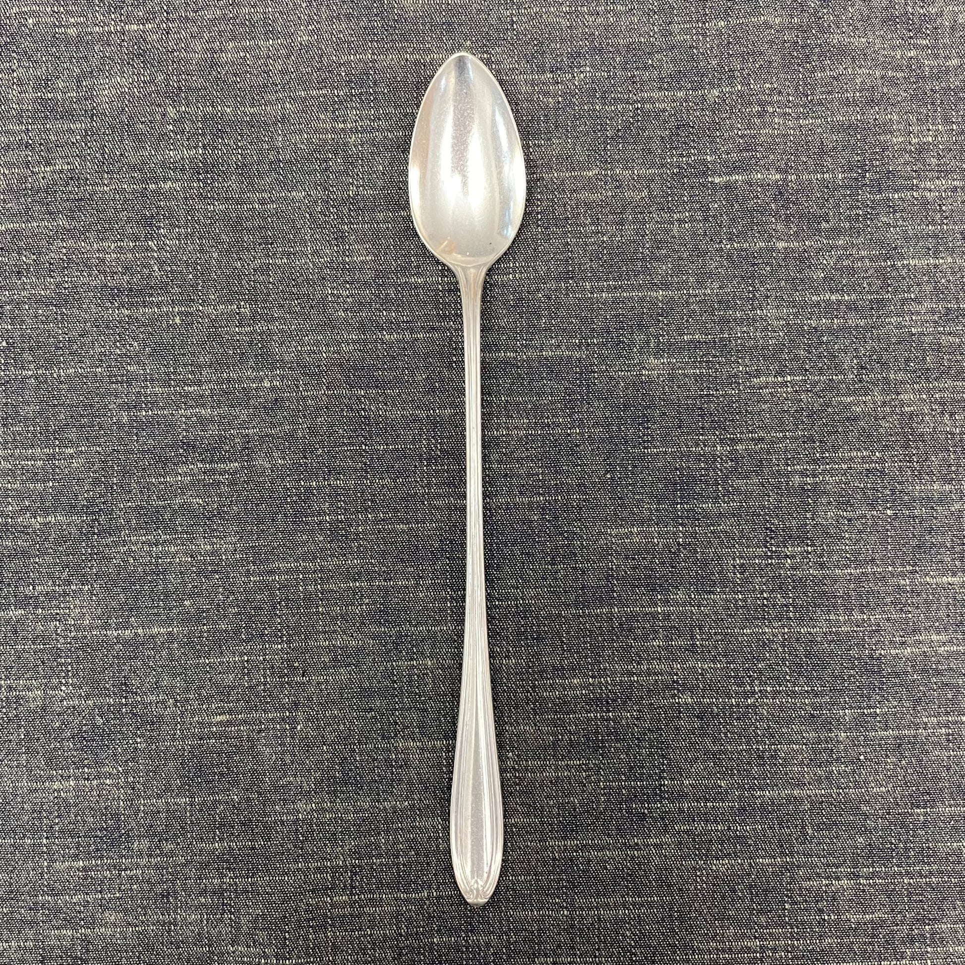 antique silver long handled teaspoon for serving jam or prop photography