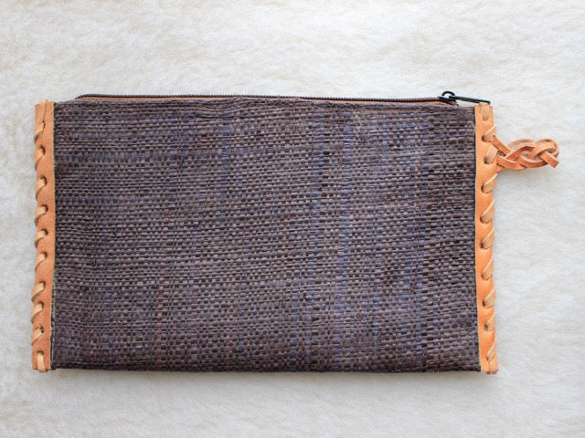 solid indigo blue muted raffia woven zippered clutch with leather trim bohemian