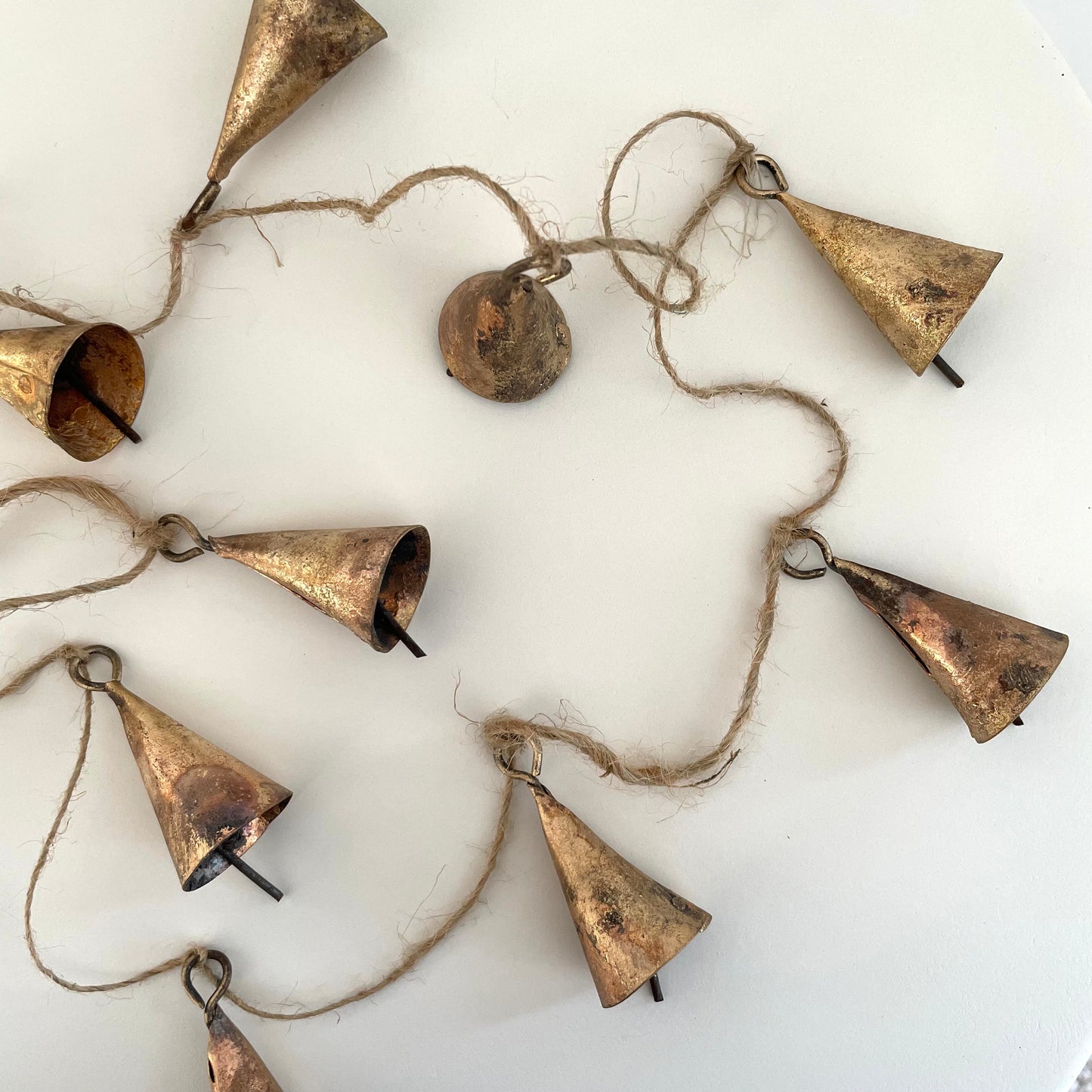 tin cone bell with brass finish on 72 inch jute garland