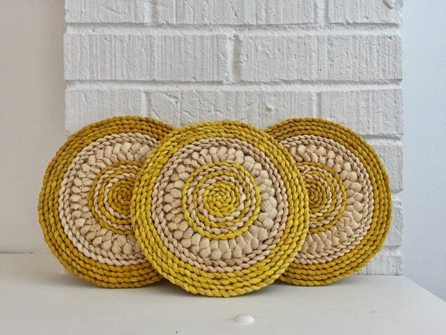 sunshine yellow and beige handwoven flat round trivets