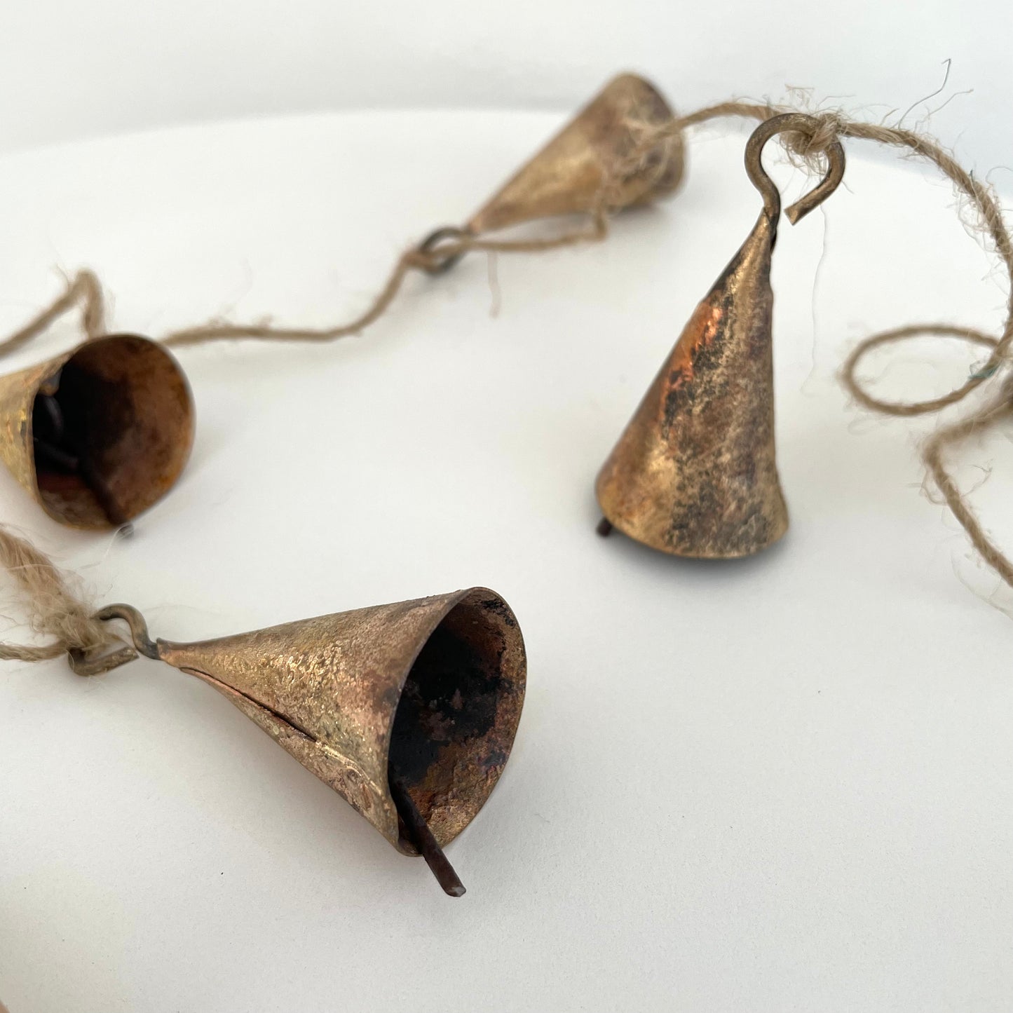 tin cone bell with brass finish on 72 inch jute garland