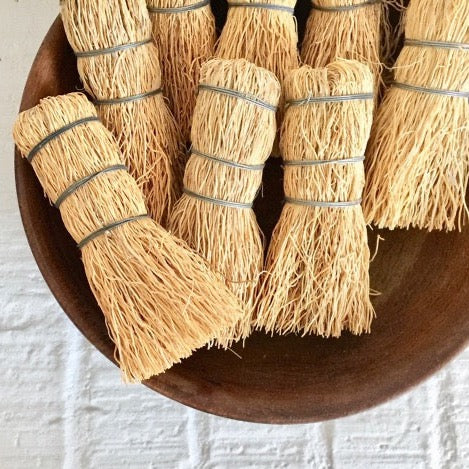 handmade natural escobeta root brush fiber dish scrubber in a wood bowl