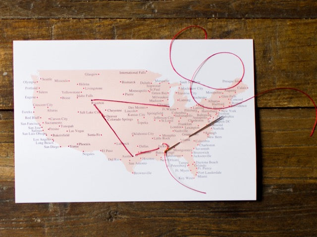 US stitching travel postcard with needle and thread