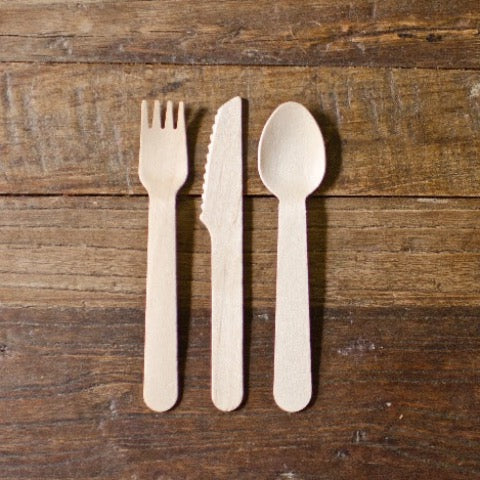 set of eco wood spoons, forks, and knives for a party
