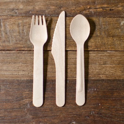set of eco wood spoons, forks, and knives for a party