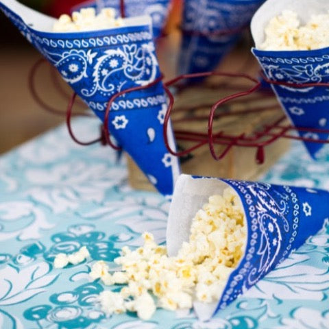 blue paper party popcorn cones in a bandana print