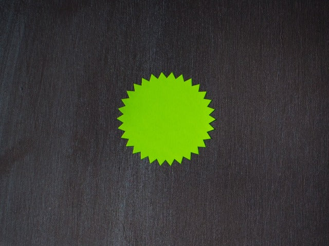 green neon round starburst sticker labels