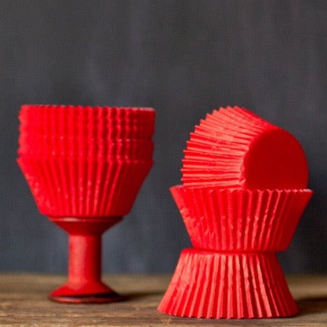 bright red solid paper cupcake liners for circus party supplies