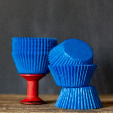 bright blue solid paper cupcake liners for circus party supplies
