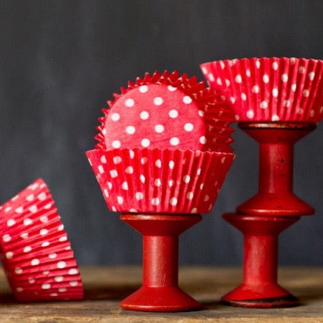 bright red polka dot paper cupcake liners for circus party supplies