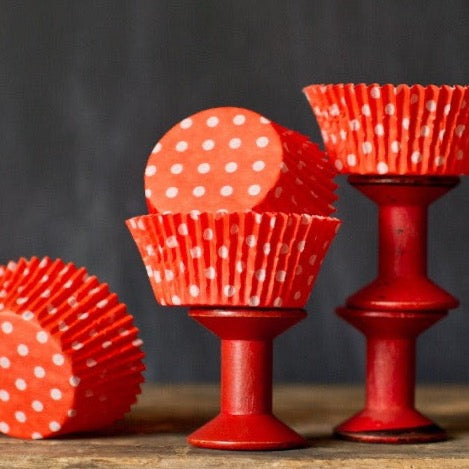 bright orange polka dot paper cupcake liners for circus party supplies