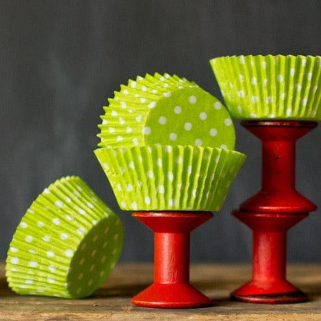 bright lime green polka dot paper cupcake liners for circus party supplies