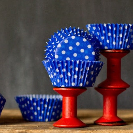 bright blue polka dot paper cupcake liners for circus party supplies