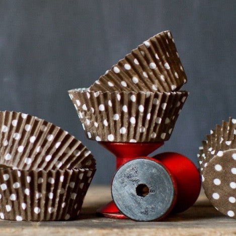 brown and white polka dot paper cupcake liners for circus party supplies