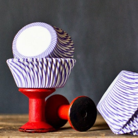 purple and white striped paper cupcake liners for circus party supplies