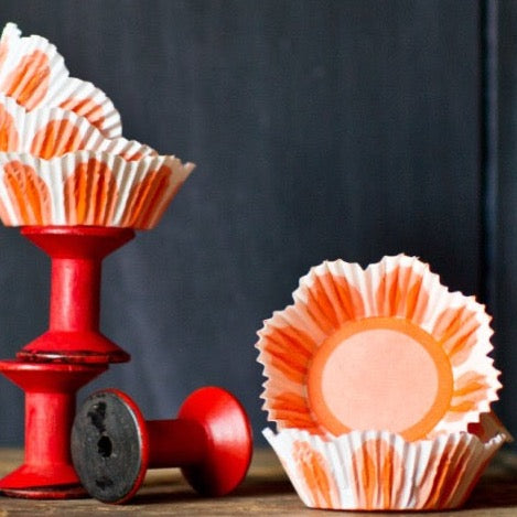 orange and white pastel tulip shaped paper cupcake liners for Easter party supplies