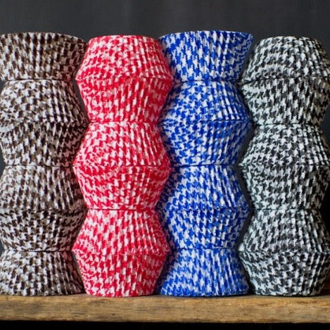 red, blue, brown, and black houndstooth printed paper cupcake liners