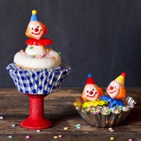 gingham paper cupcake liners in a rainbow of colors with retro clown toppers