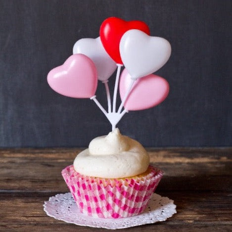 hot pink and white gingham paper cupcake liners for Valentines Day with heart toppers