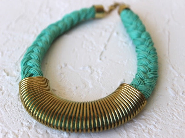 turquoise brader collar necklace with gold metal trim