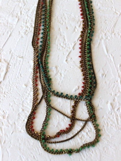 beaded and knotted crocheted long layering necklace for a bohemian outfit