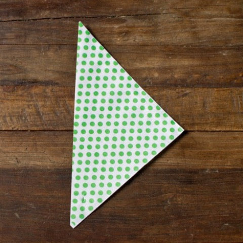 green and white polka dot paper party cones to hold popcorn or treats
