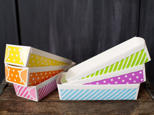 large paper loaf baking pans in a rainbow of colors