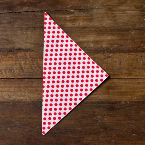 red and white polka dot paper party cones to hold popcorn or treats