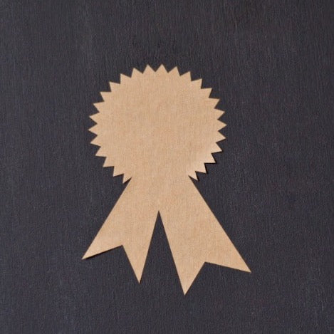 tan kraft sticker labels in an award ribbon shape