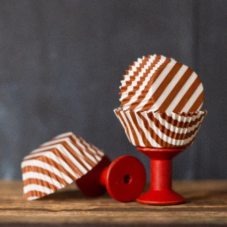 brown and white striped paper cupcake liners for circus party supplies