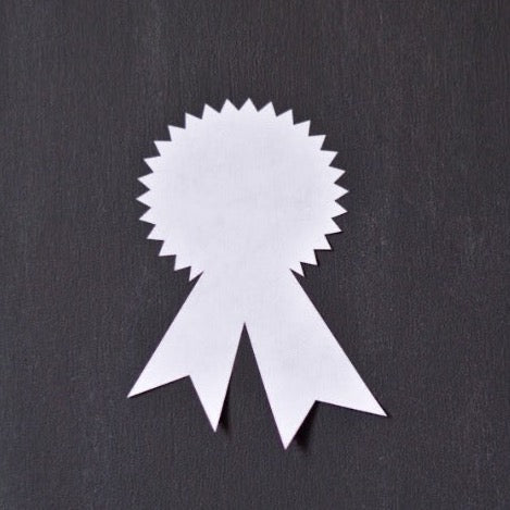 white sticker labels in an award ribbon shape