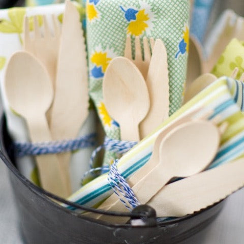 eco wooden cutlery wrapped with a napkin for a picnic