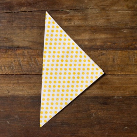 yellow and white polka dot paper party cones to hold popcorn or treats